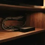 A neat array of audio and video cables, illuminated by warm cinematic light